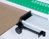 The cutting guide allows users to produce perforated cardboard to match the size of the item being shipped